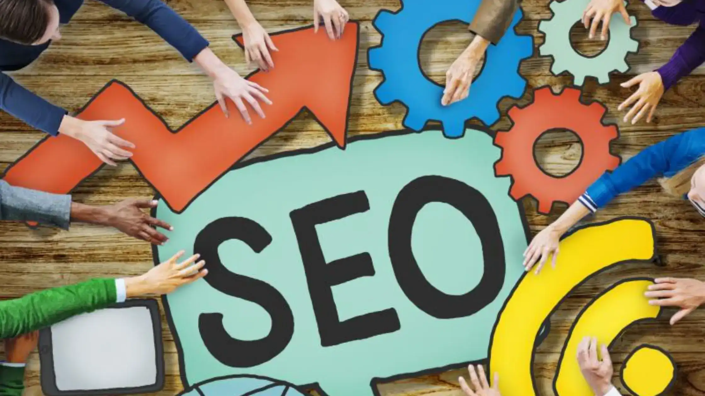 Overhead view of hands reaching towards SEO icons highlighting hvac seo company